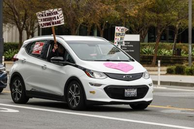 Uber and Lyft protesters driving by Uber headquarters at 1725 Third Street